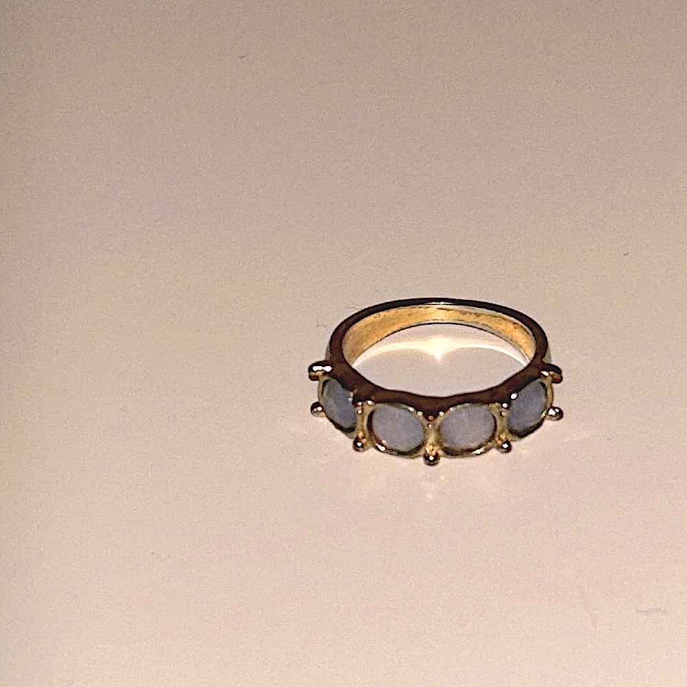 Gold plated ring approx size 7. With accent stones